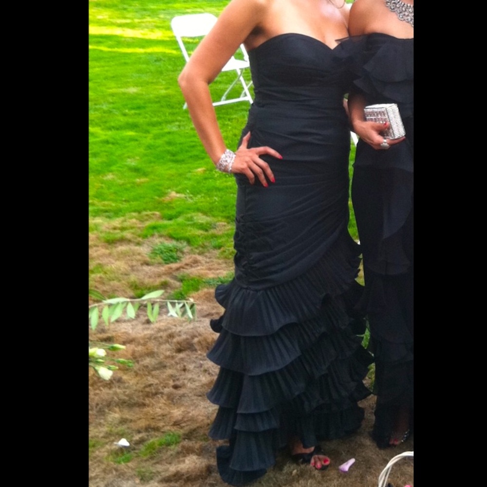 Elegant black strapless gown with tiered ruffled bottom